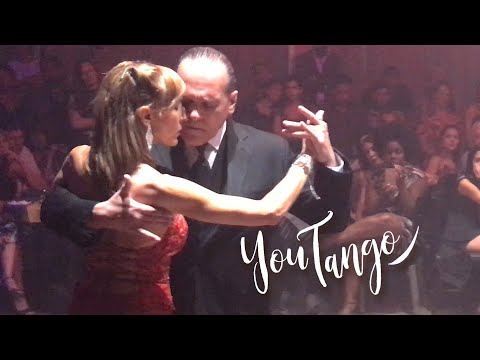  Lorena Ermocida  and  Oscar Martinez Pey  are  dancing  to  the  tango  "  Destino de Flor  "  by  Roberto Florio  in  2019