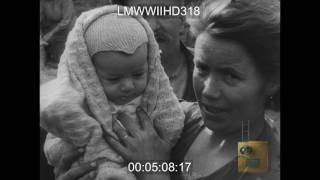 FRANCE; AMERICAN SOLDIERS IN TOWN GOING BUILDING TO BUILDING; BUILDING ON FIRE; RUINS  - LMWWIIHD318