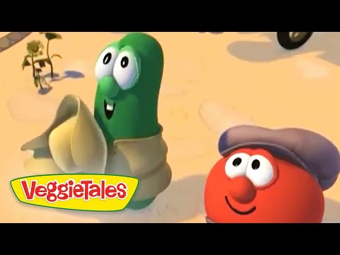 Two VeggieTales characters, a green bean and a red tomato with a hat, stand in a sandy desert; VeggieTales logo in the corner.
