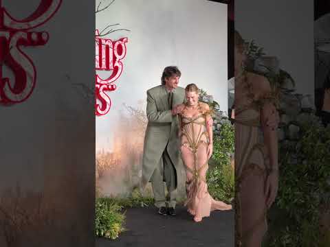 Margot Robbie & Jacob Elordi caught in the rain at the "WUTHERING HEIGHTS" UK Premiere