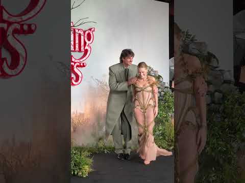Margot Robbie & Jacob Elordi caught in the rain at the "WUTHERING HEIGHTS" UK Premiere