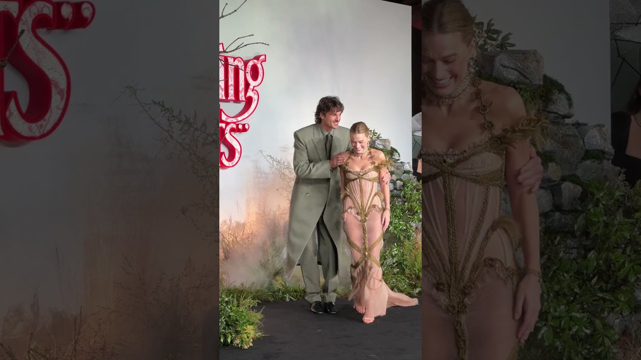 Margot Robbie & Jacob Elordi caught in the rain at the "WUTHERING HEIGHTS" UK Premiere