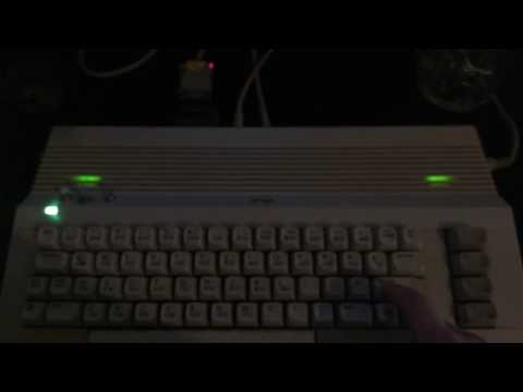 C64 with SID2SID, dual VU meters & self changing RGB power LED