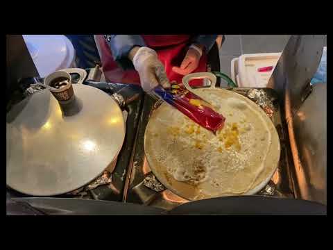 Street food in Qatar: Traditional Arabic Crepe (Kubos Regag) in Soug Waqif Doha