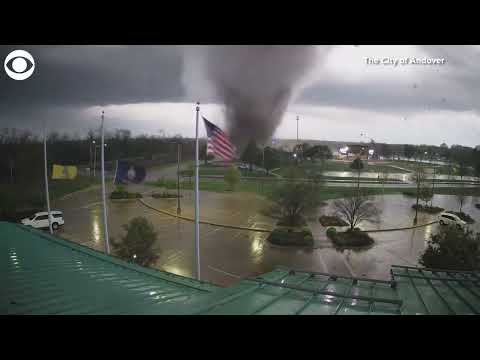 Tornado uproots trees as it rips through city in Kansas