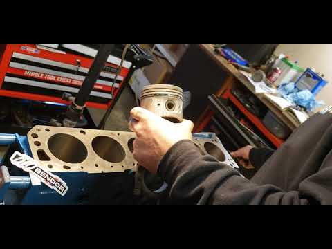 Installing piston rings on our Datsun L24 pistons