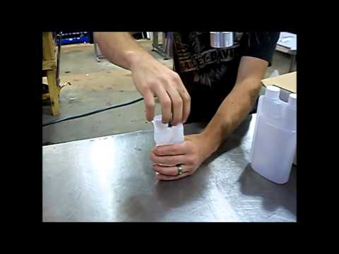 Handheld Chuck Capper on Bedex Bottles - APACKS