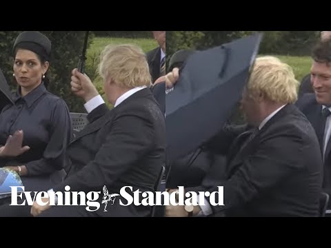 Boris Johnson had umbrella troubles again leaving Prince Charles & Priti Patel laughing
