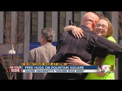 Xavier students offer free hugs on Fountain Square