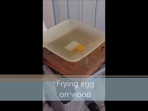 Frying egg on the wood. Fantastic!