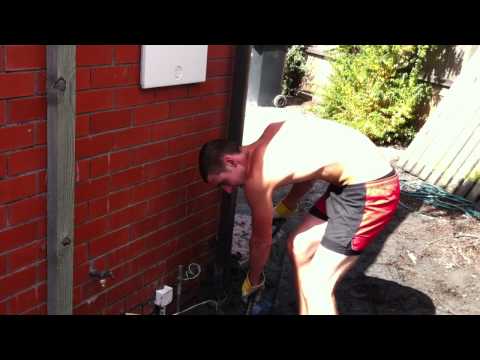 Young Men Clear Liquefaction after Christchurch Quake