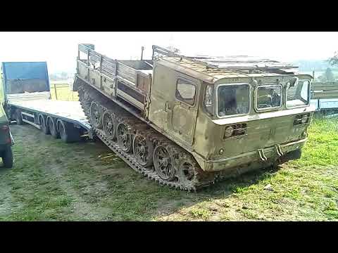 ATS-59G soviet artillery tractor (based on a t-54 chassis) being loaded (reverse drive)