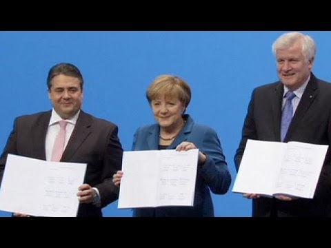Merkel celebrates coalition deal with Social Democrats