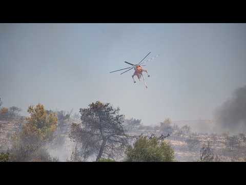 Live: Firefighters battle raging wildfires across Greece