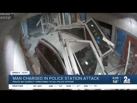 Man charged in police station attack