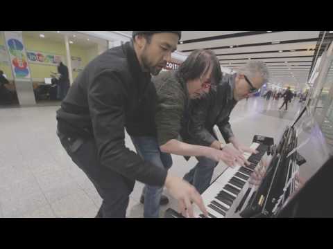 Three Dudes Jam at the Airport Piano