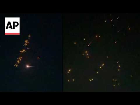 Video Thumbnail: AP video shows apparent Iran ballistic missiles dropping smaller bomblets