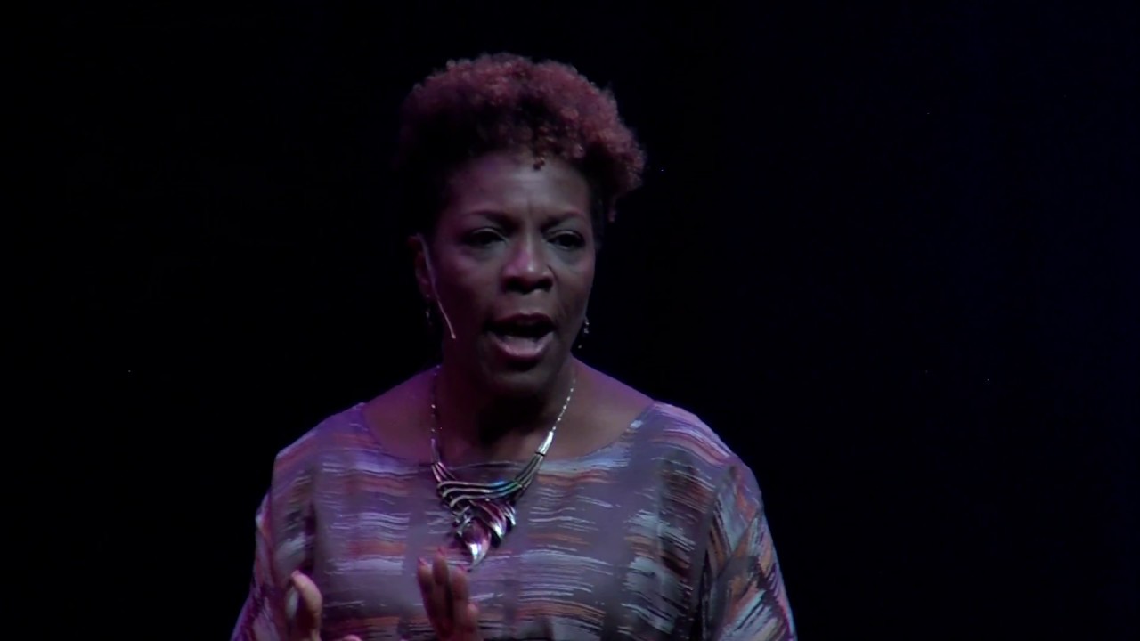 TEDx Talk thumbnail — Dr. TLC on stage