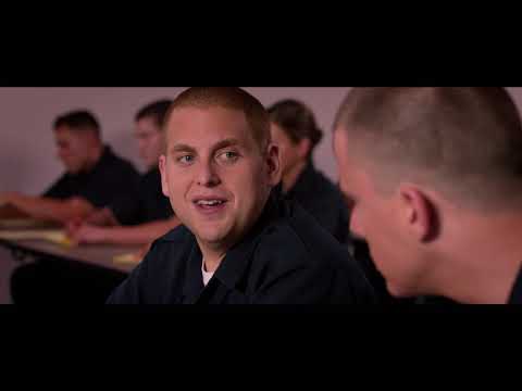 Trailer frame: the undercover cops at a school party, lights flaring in beat