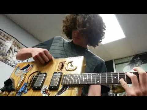 Charlie Tona sharing Bo Diddley history with The School of Rock students