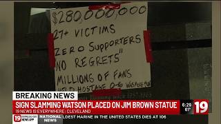 Signs slamming Watson placed on Jim Brown statue
