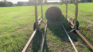 Self-loading hay trailer