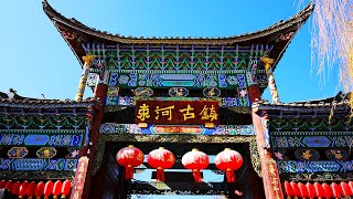 `ShuHe Ancient Town, known as `ShaoWu` in NaXi language, was formed by the JuBao Mountain behind the village, which is shaped like a pile of peaks. It is also an important well-preserved market town on the Ancient Tea-Horse Road, a living specimen of the NaXi ancestors’ transition from farming civilization to commercial civilization, and a model of market town construction formed by opening up to the outside world and caravan activities. ShuHe Ancient Town, BaiSha Ancient Town and DaYan Ancient Town together form the World Heritage Site of LiJiang Ancient Town. Xu XiaKe once passed by ShuHe River when he visited JieTuo Forest in ZhiShan. `Ten Harmonies` is the ancient name of today`s ShuHe. ` With Bob`s Street Snapshots . . . ShuHe ancient town, just north of LiJiang, YunNan province