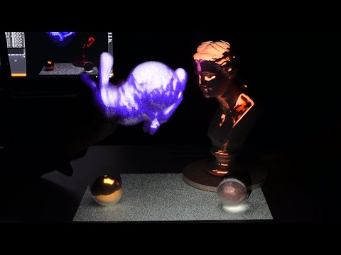 Realistic Dynamic Projection Mapping Using Real-Time Ray Tracing