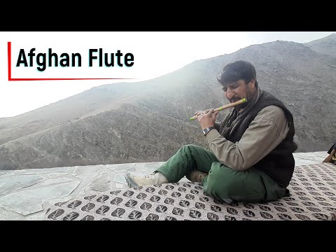 Afghan Flute Played by A Man In Mountains
