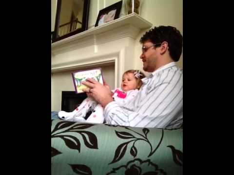 Daddy and Olivia read "Hairy Maclary, Sit"