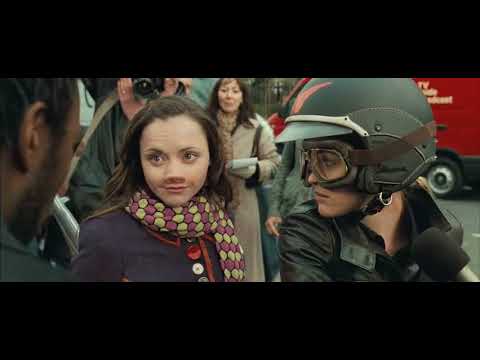 Late-film montage from the trailer — city at night and party lights, music cresting