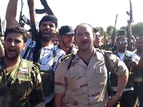 مظاهرة تحفيزية خرج بها النقيب عمار الواوي ومقاتليه قبل التوجه إلى جبهات القتال في حلب