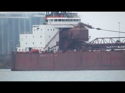 James R. Barker blows a Master Salute in honor of the Edmund Fitzgerald