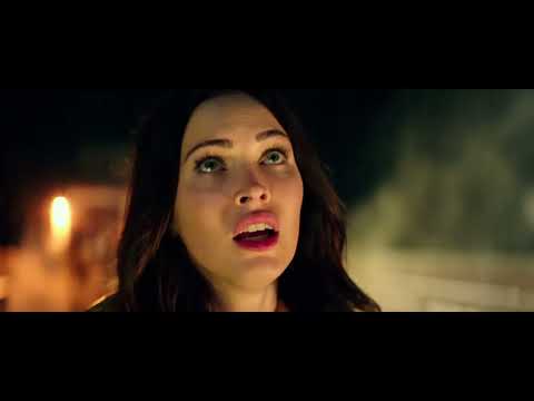 Teenage Mutant Ninja Turtles (2014) official trailer still: the four turtles sprint across a New York rooftop at night
