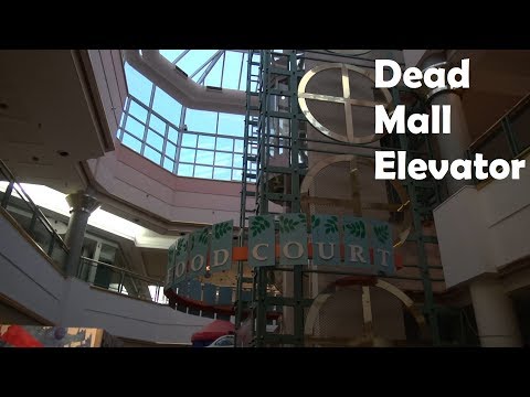 Glass Montgomery Hydraulic Elevator in a Dead Mall