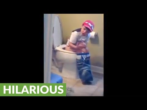 Kid caught singing Justin Bieber in the bathroom