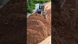 Download lagu You can visit at long video dozer pushing dirt connected road water mp3