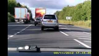 preview picture of video 'VK60 DGF - dangerous driving on A46 roundabout at Evesham and then makes own lane to overtake'