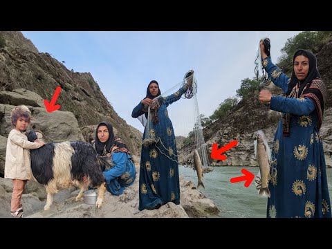 Khadija caught a large fish with a net and went to a dangerous rock for food.