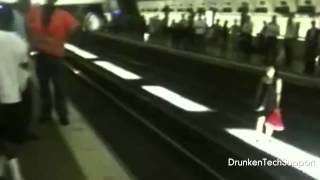 Confused Woman Caught on Video Trying to Cross Train Tracks