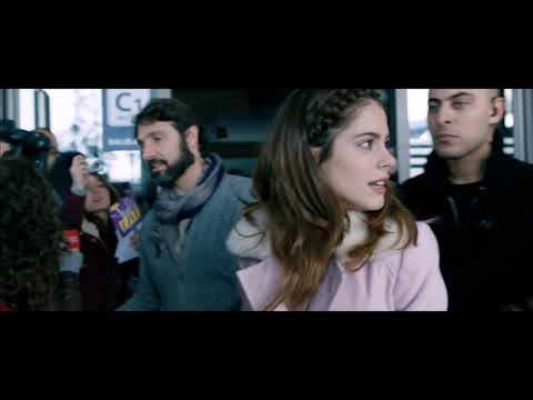 Trailer shot: Tini stepping into a warm follow-spot as the chorus of 'Siempre Brillarás' crests