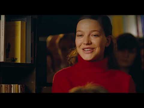 Trailer coda: spotlight fades at a reading; the music tilts from celebration to consequence