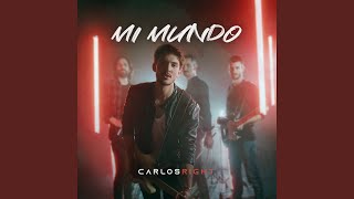 Kadr z teledysku Mi Mundo tekst piosenki Carlos Right