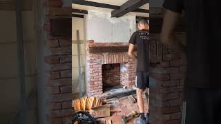 Chimney breast construction in Sunningdale with wood stove installation and reclaimed brick slips