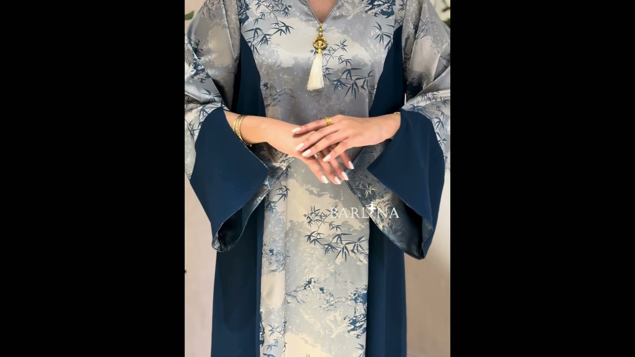 Blue jalabiya with a floral front detail - XS