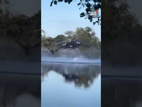 Helicopter crashes into pond while scooping water for wildfire