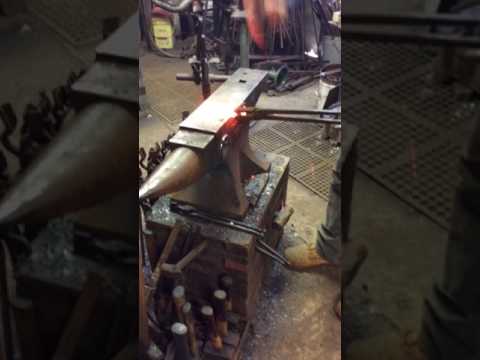 Blacksmithing a tomahawk shaping the hawk