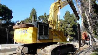 KOMATSU PC1000LC pulling out trench shoring