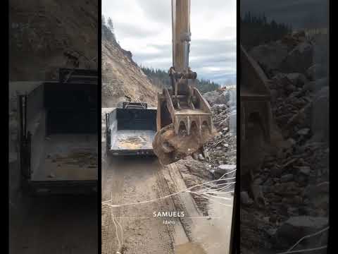 Loading big rocks in the dump trailer
