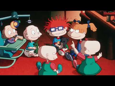 Theatrical trailer frame: the babies rolling into EuroReptarland as bright brass and pop cues kick in